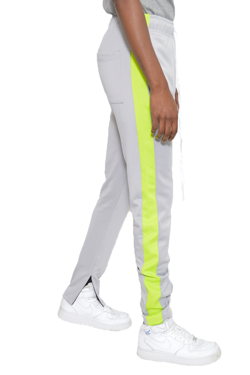 A pair of stylish slim fit track pants featuring a single stripe detail and hidden ankle zipper, perfect for workouts and casual wear.