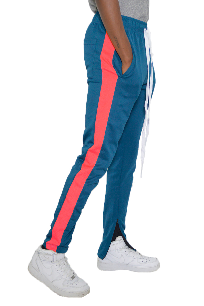 A pair of stylish slim fit track pants featuring a single stripe detail, tug-free zipper closure, and hidden ankle zippers, perfect for active wear.