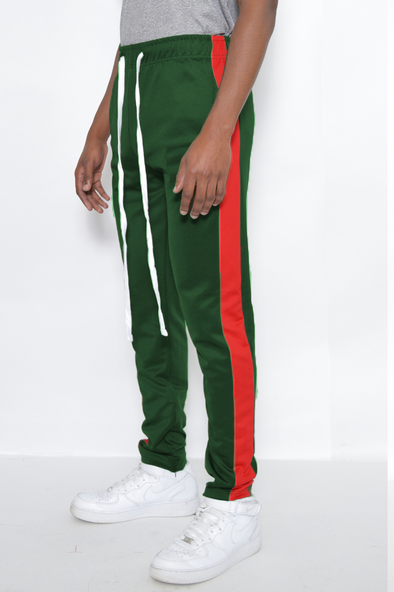 A pair of stylish slim fit track pants featuring a single stripe detail and hidden ankle zipper, perfect for active wear.