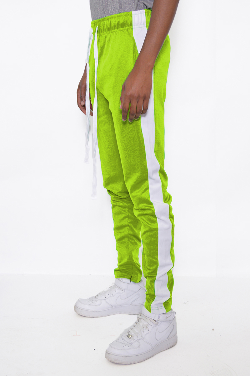 Slim fit track pants in vibrant lime and white with single stripe detail and hidden ankle zipper.