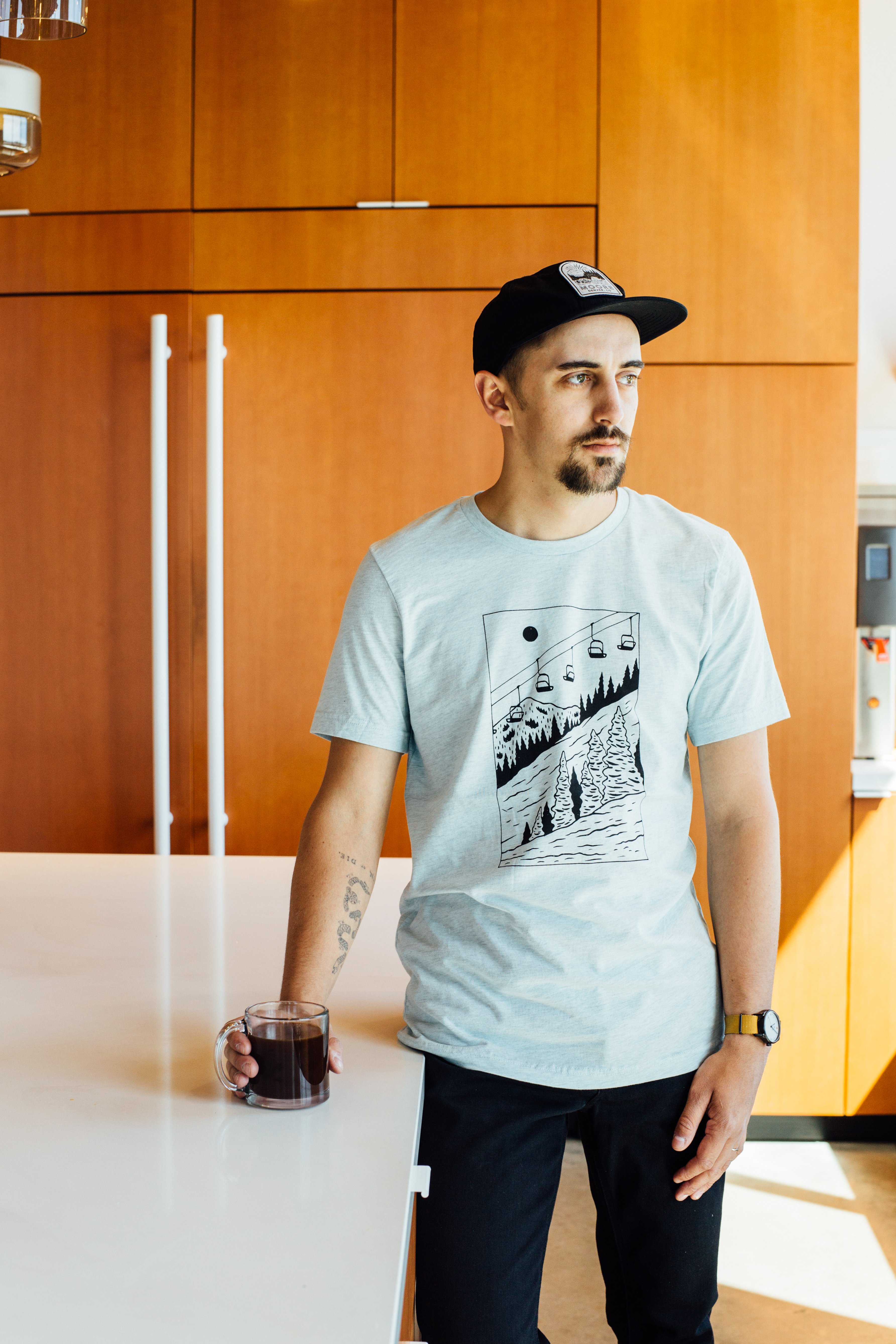 Ice blue Slope Tee featuring ski lift design, made from soft tri-blend fabric.