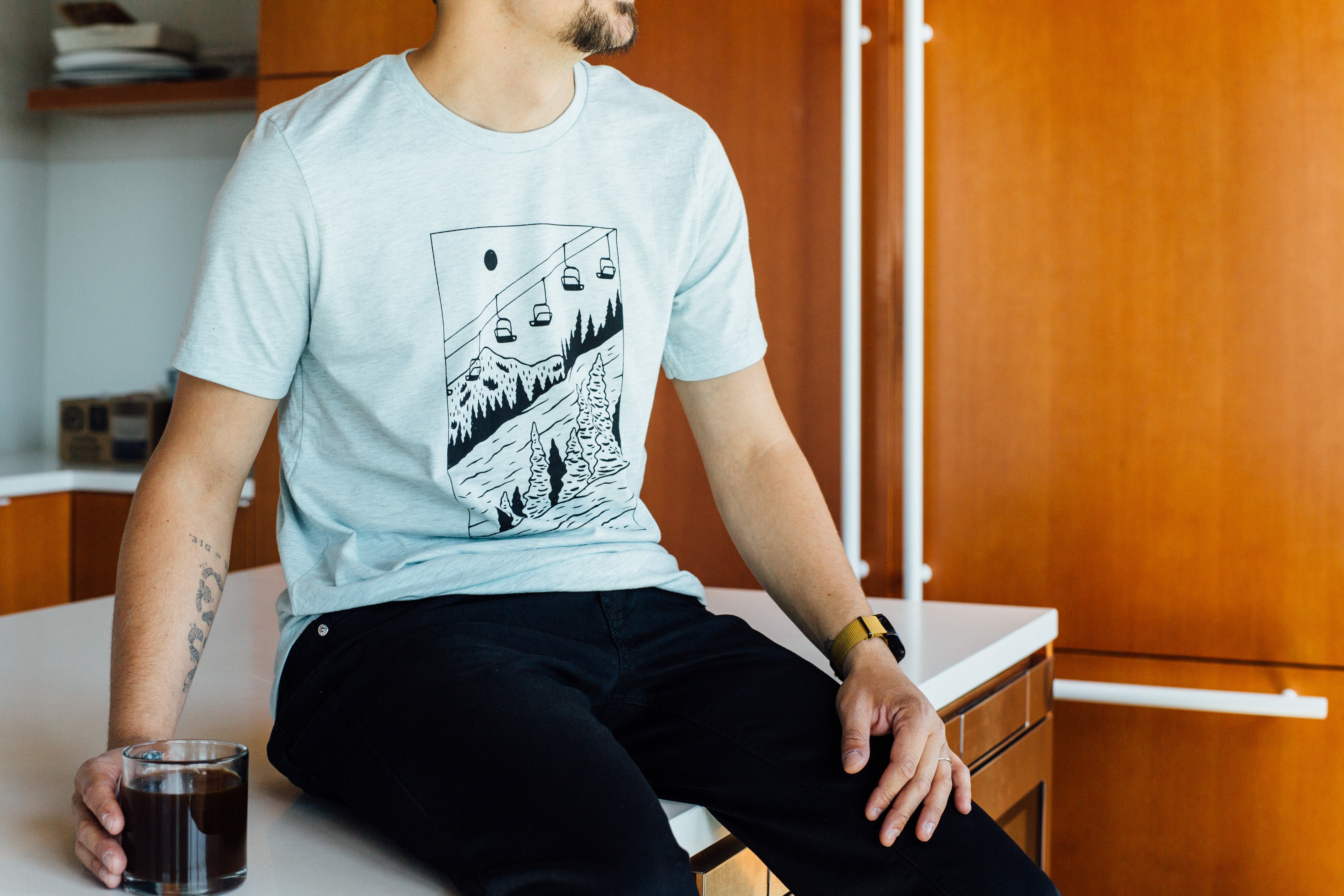 Ice blue Slope Tee featuring ski lift design, made from soft tri-blend fabric.