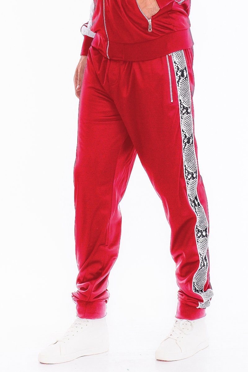 A pair of stylish SNAKE SIDE TRACK PANTS featuring an elastic waist, ankle zippers, and zippered back pockets, perfect for casual and active wear.