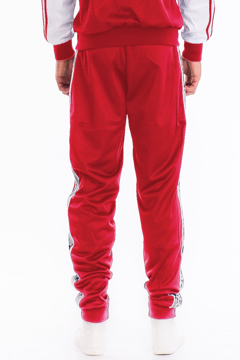 A pair of stylish SNAKE SIDE TRACK PANTS featuring an elastic waist, ankle zippers, and zippered back pockets, perfect for casual and active wear.