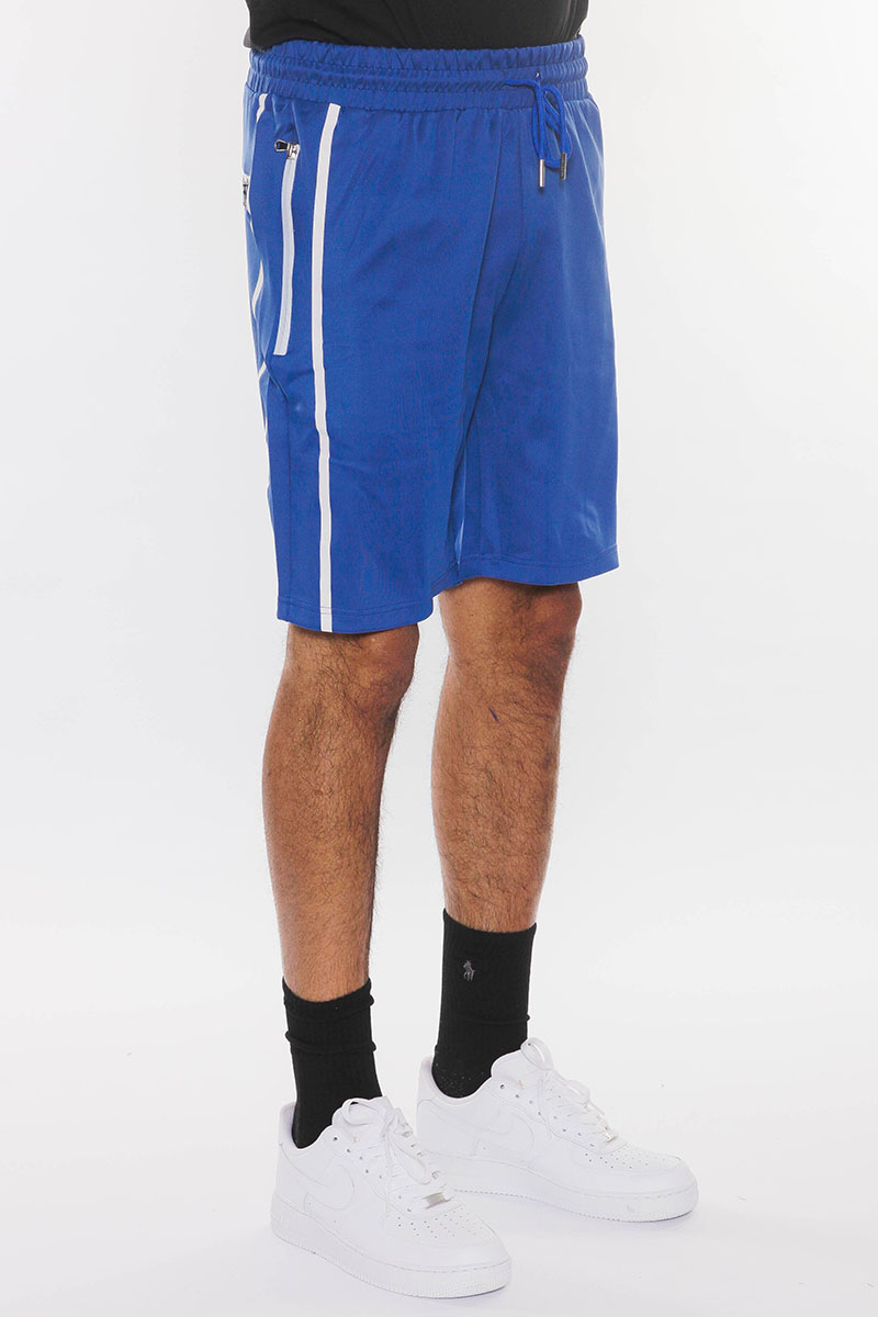 SOLID ATHLETE TAPE SHORTS featuring an elastic waist, drawstring, and zippered pockets, modeled by a person standing at 5'11 in a medium size.