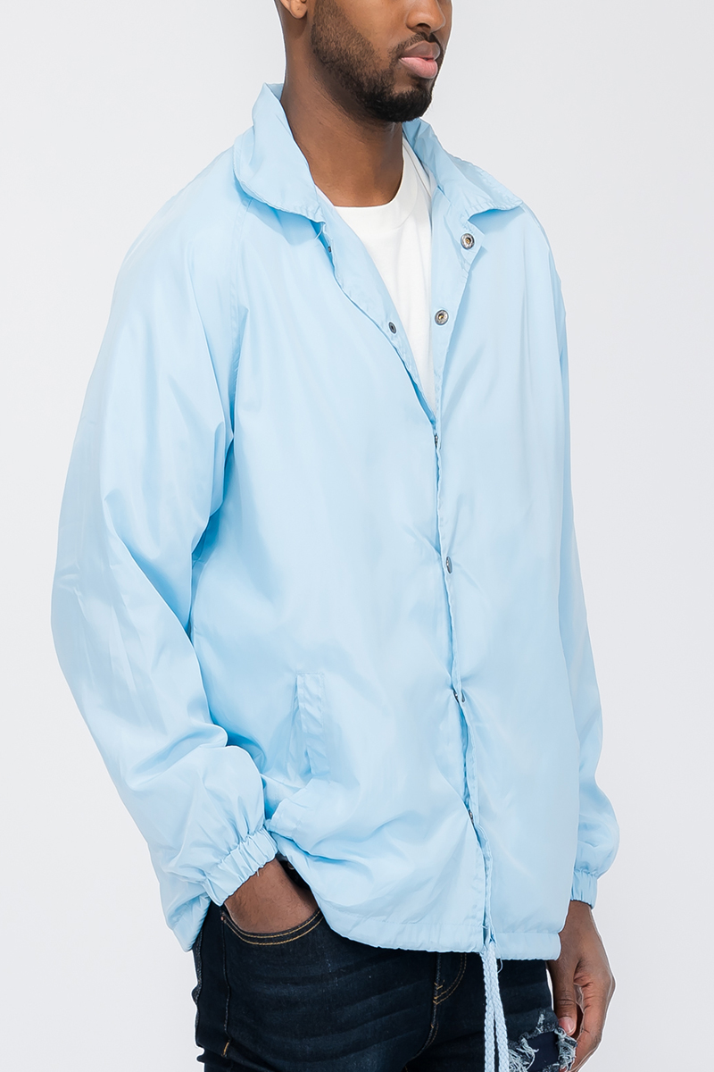 Solid Coachs Jacket in stylish design with snap button closure, made from weather-resistant 100% polyester.