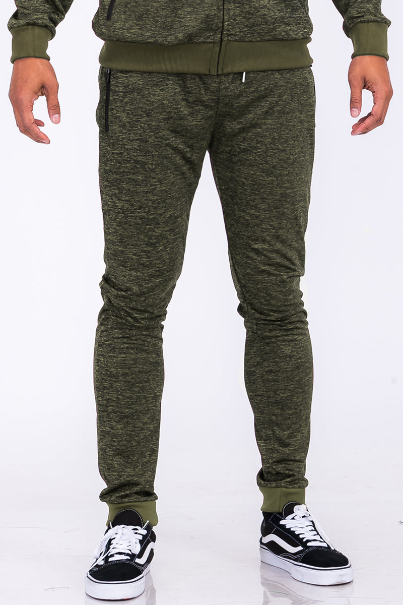 A pair of stylish speckled performance joggers featuring an elastic waist, cuffed ankles, and multiple pockets, perfect for workouts and casual wear.