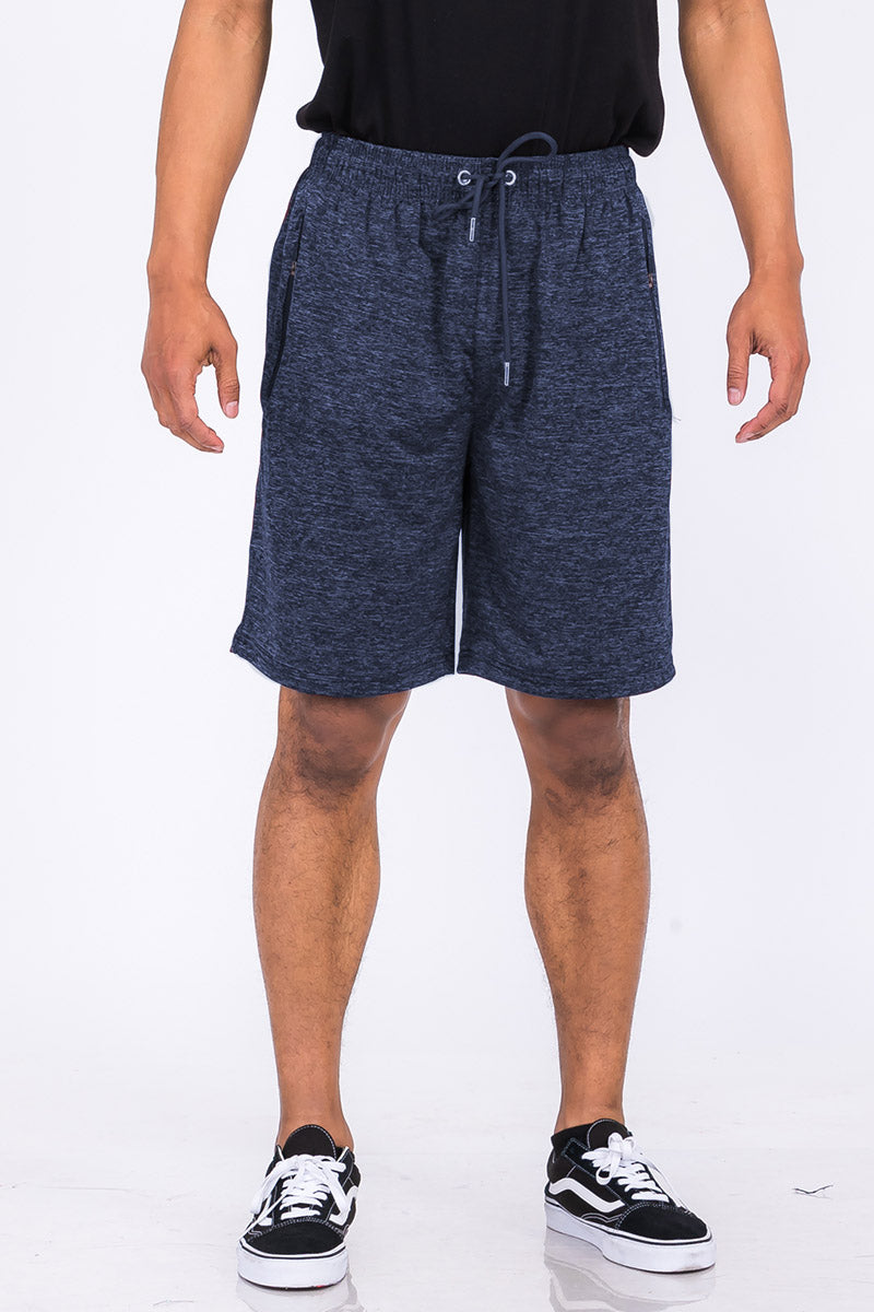 A pair of speckled performance shorts featuring an elastic waist, drawstring, and pockets, designed for comfort and mobility.