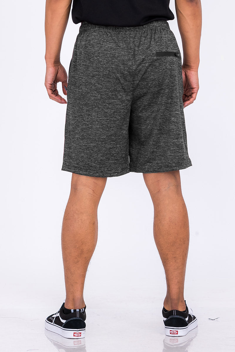 A pair of speckled performance shorts featuring an elastic waist, drawstring, and pockets, designed for comfort and mobility.