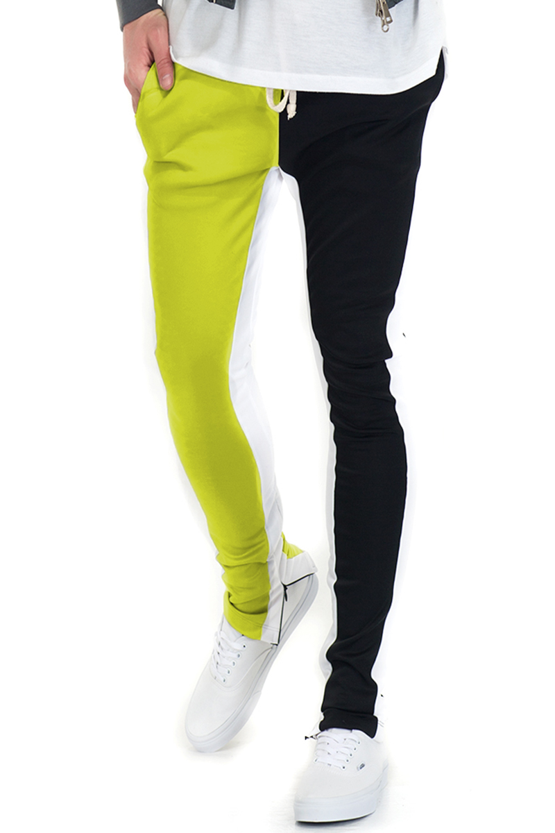 A pair of stylish Split Two Tone Track Pants featuring an elastic waist, drawstring, and hidden ankle zippers, perfect for workouts and casual wear.