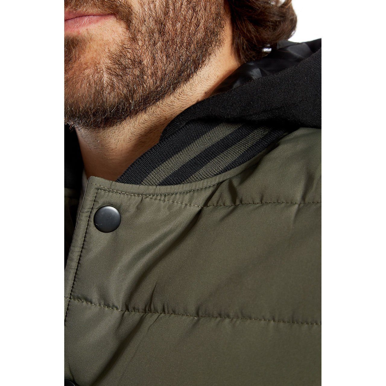 Stanley Quilted Puffer Jacket featuring fleece sleeves and hood, designed for warmth and style.