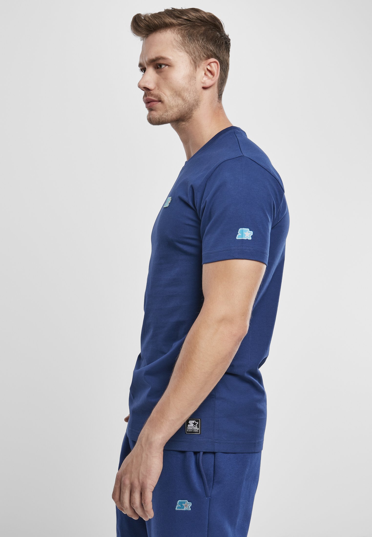 A stylish Starter Essential Jersey made from 100% cotton, showcasing its soft texture and versatile design in a variety of colors.