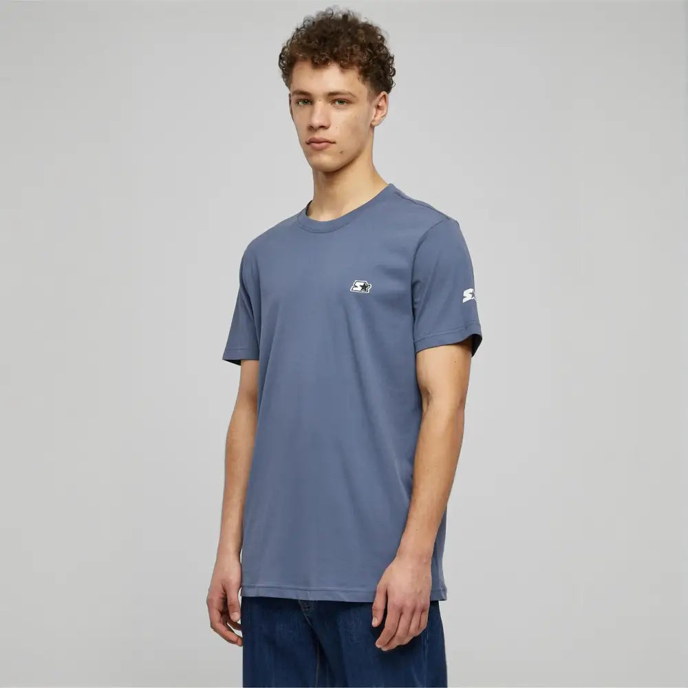 A stylish Starter Essential Jersey made from 100% cotton, showcasing its soft texture and versatile design in a variety of colors.