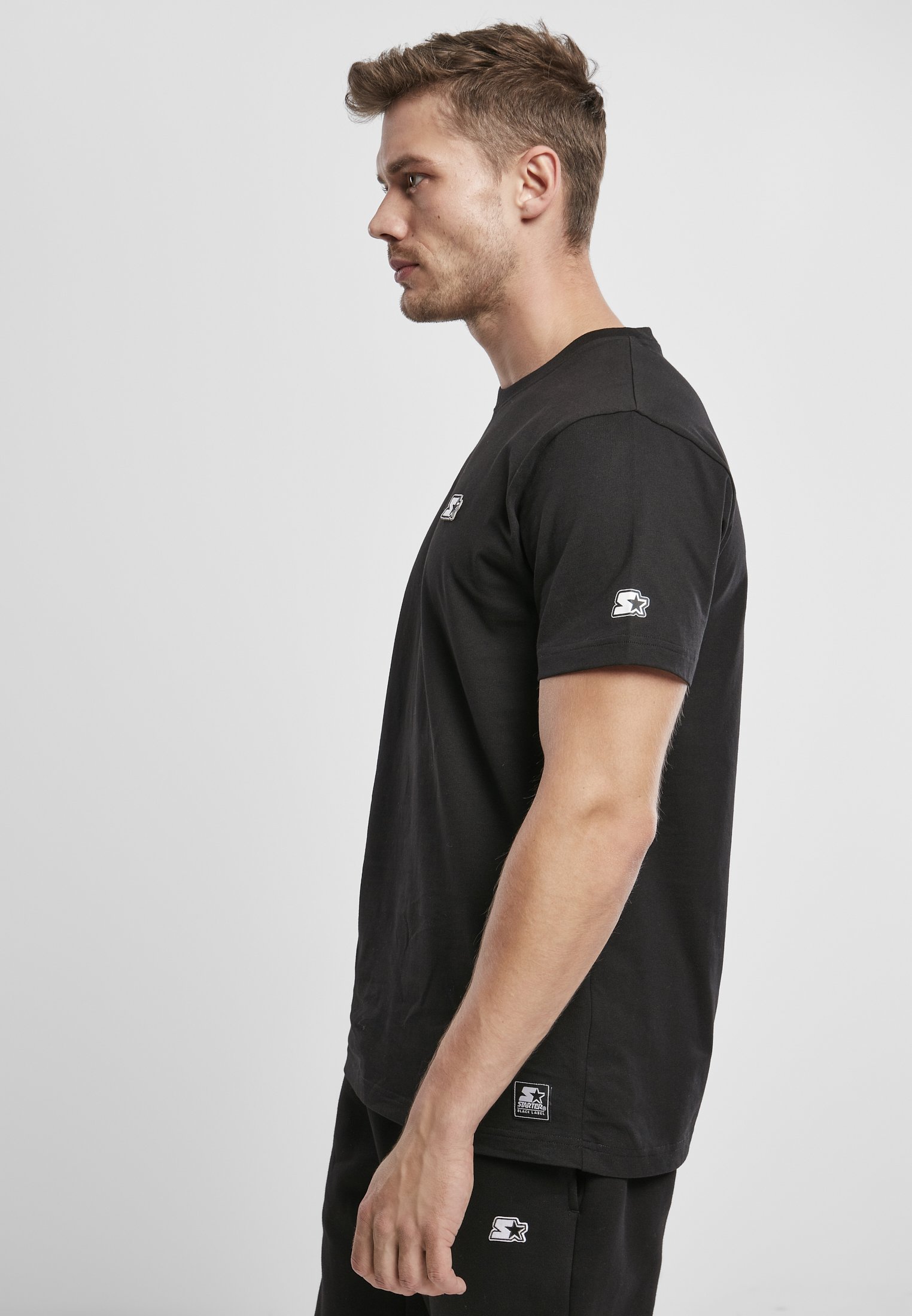 A stylish Starter Essential Jersey made from 100% cotton, showcasing its soft texture and versatile design in a variety of colors.