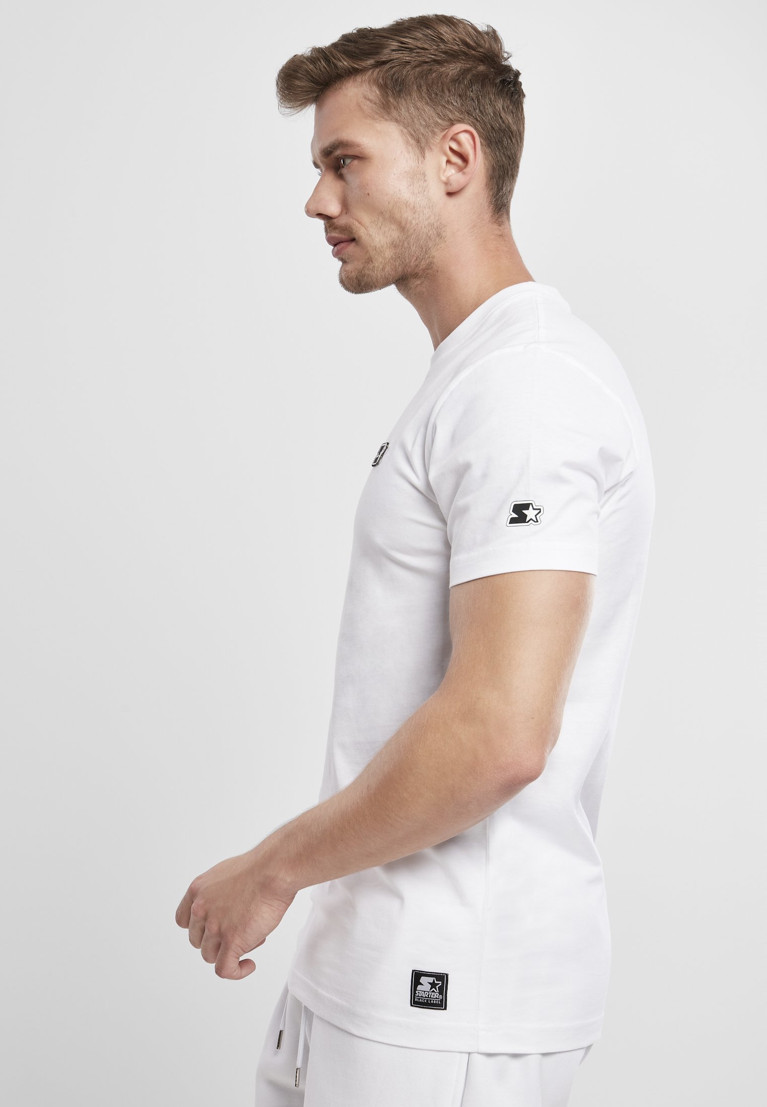 A stylish Starter Essential Jersey made from 100% cotton, showcasing its soft texture and versatile design in a variety of colors.