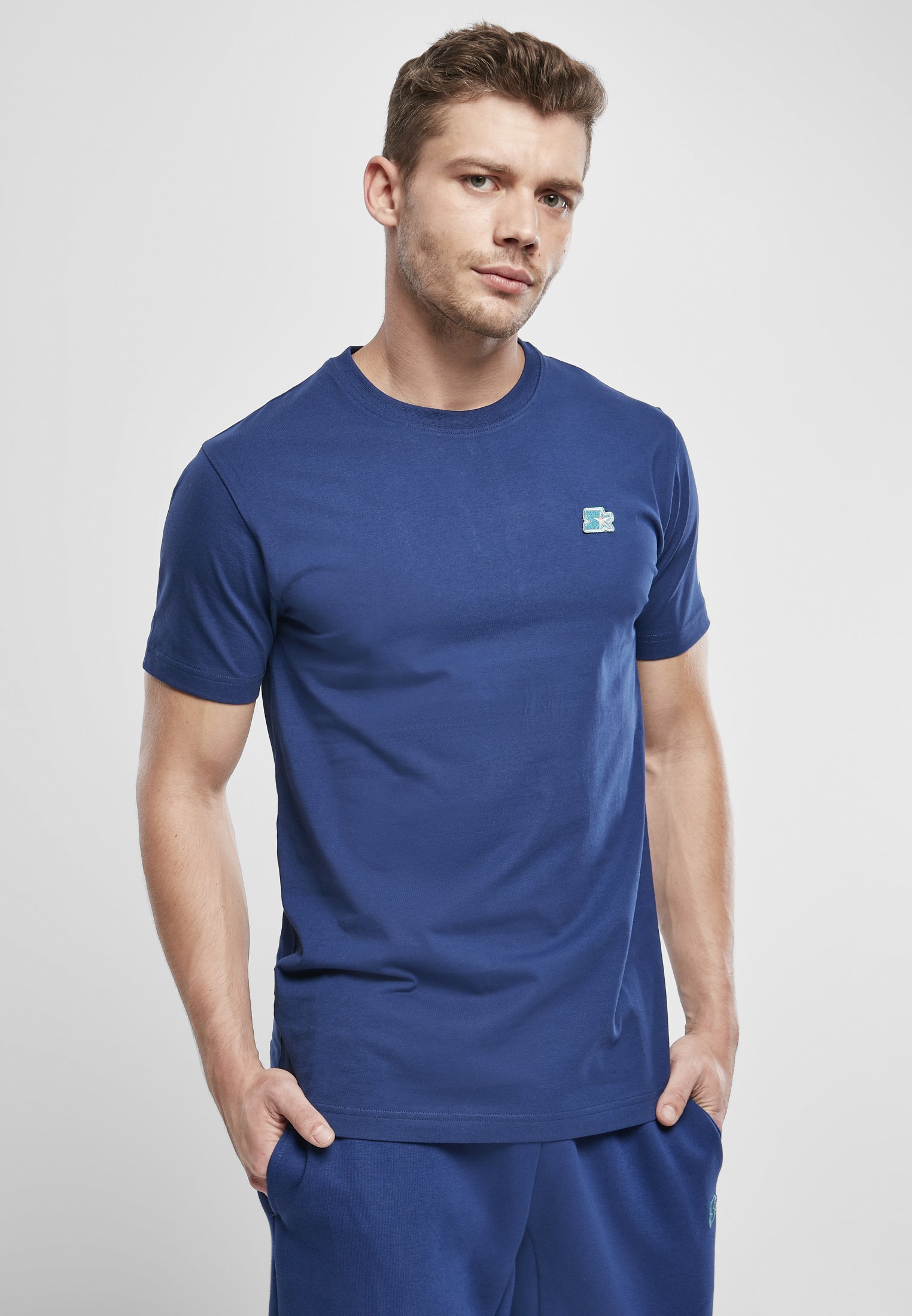 A stylish Starter Essential Jersey made from 100% cotton, showcasing its soft texture and versatile design in a variety of colors.