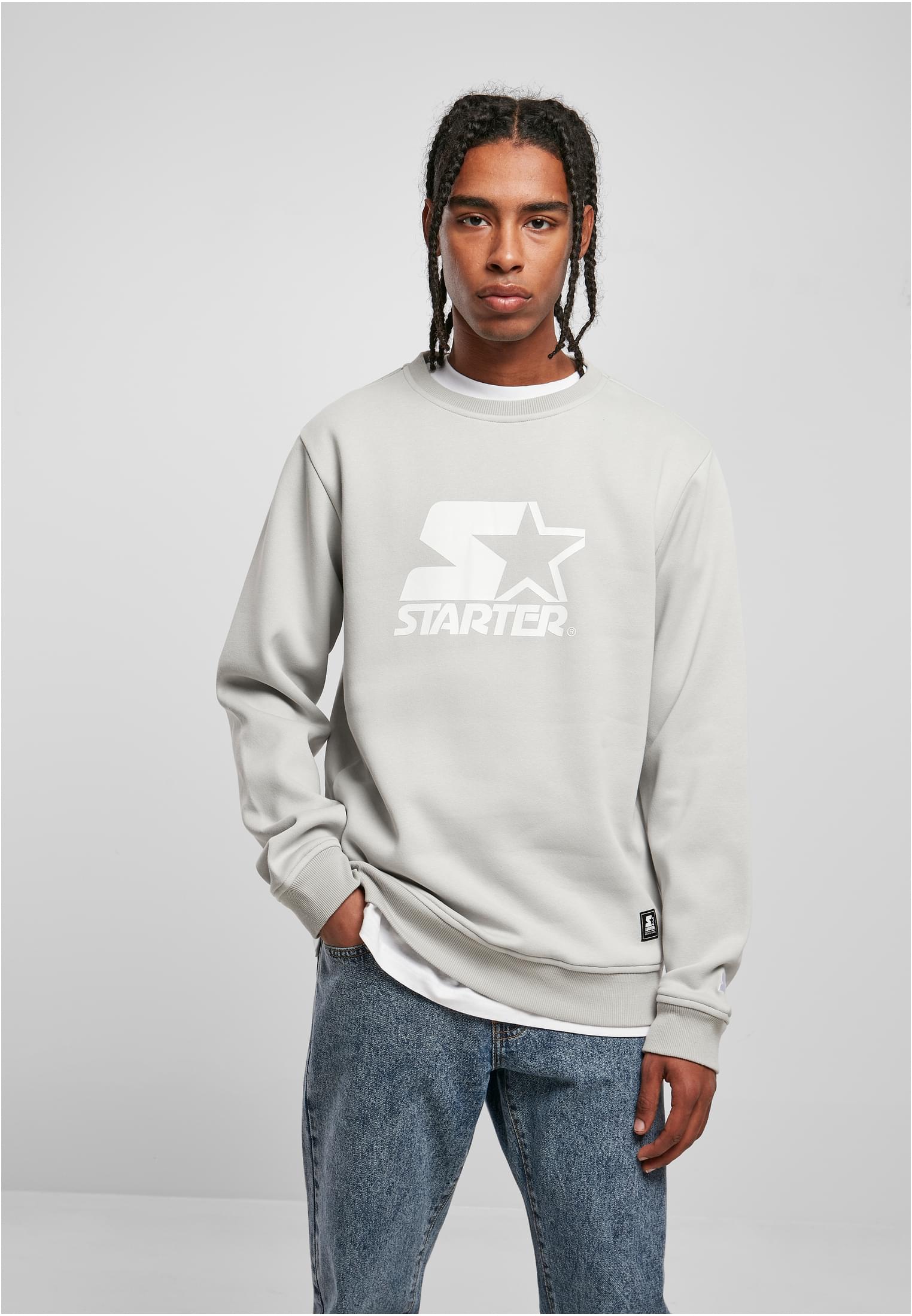 Men's Starter Logo Crewneck Sweatshirt featuring a large logo print on the chest, ribbed cuffs, and a round neck design in soft brushed fleece.