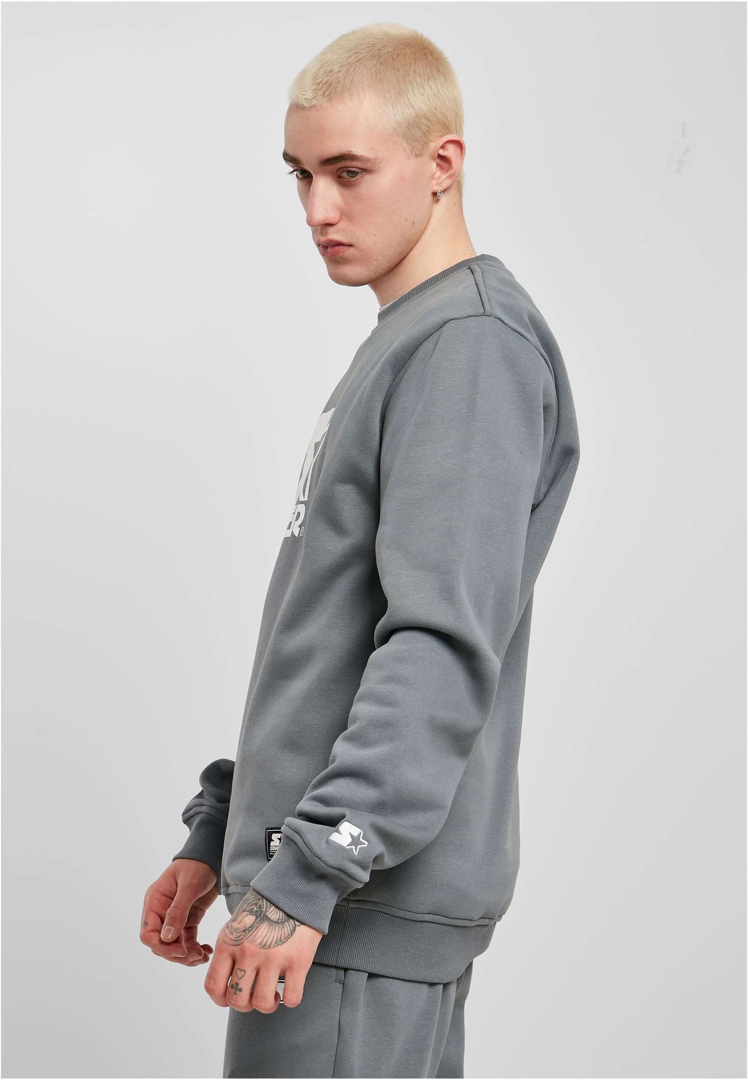 Men's Starter Logo Crewneck Sweatshirt featuring a large logo print on the chest, ribbed cuffs, and a round neck design in soft brushed fleece.