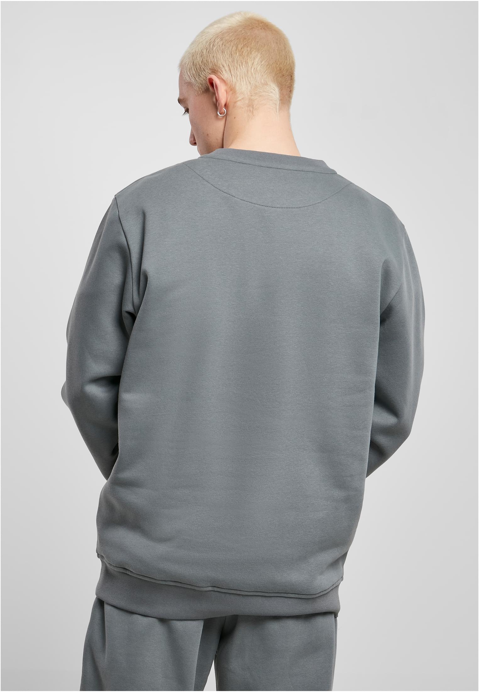 Men's Starter Logo Crewneck Sweatshirt featuring a large logo print on the chest, ribbed cuffs, and a round neck design in soft brushed fleece.