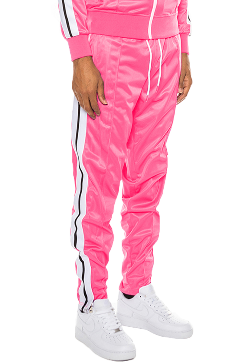 Striped Tape Track Pants featuring an elastic waist, ankle zippers, and pockets, made from 100% polyester.