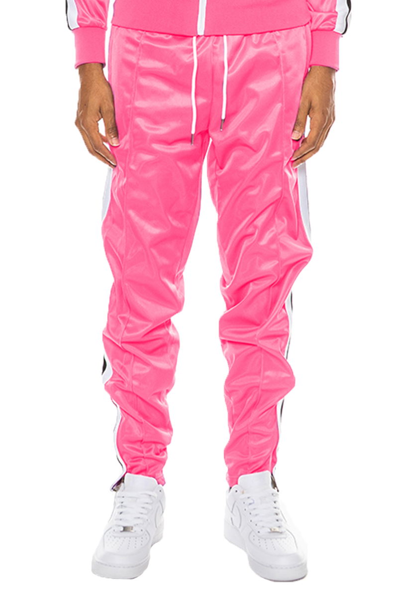 Striped Tape Track Pants featuring an elastic waist, ankle zippers, and pockets, made from 100% polyester.