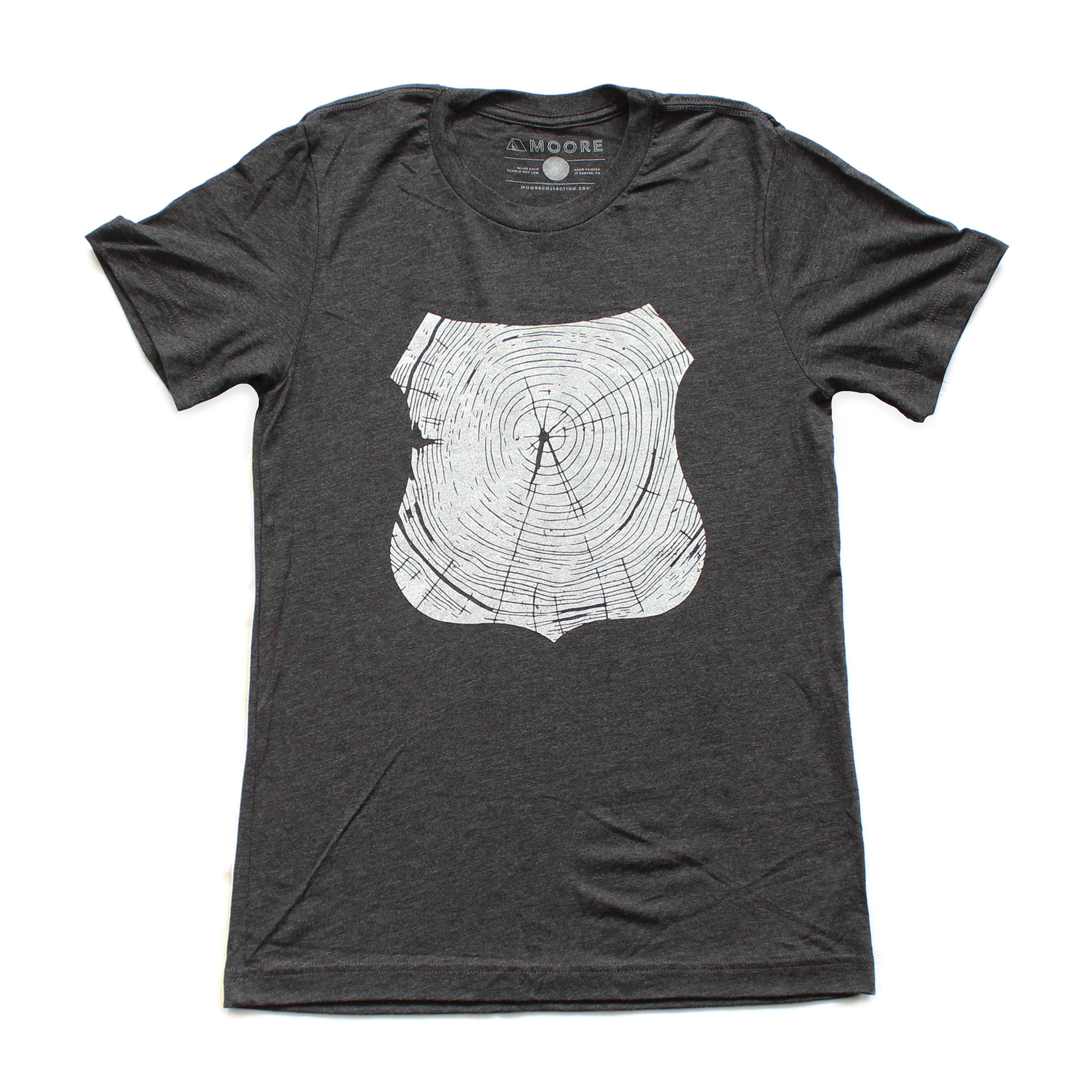 Charcoal Stump Tee featuring a hand-drawn forest design, made from a soft tri-blend fabric.