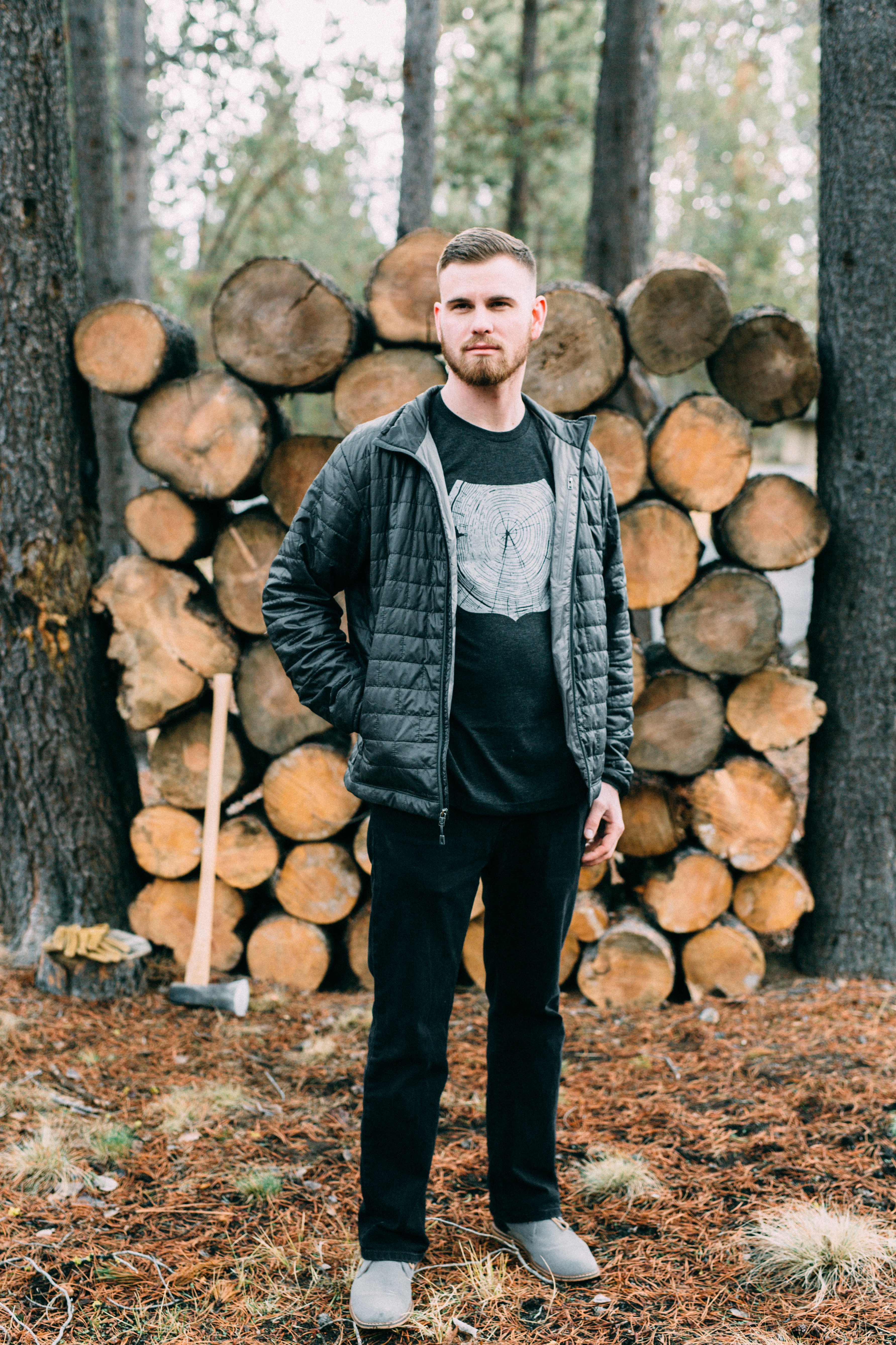 Charcoal Stump Tee featuring a hand-drawn forest design, made from a soft tri-blend fabric.