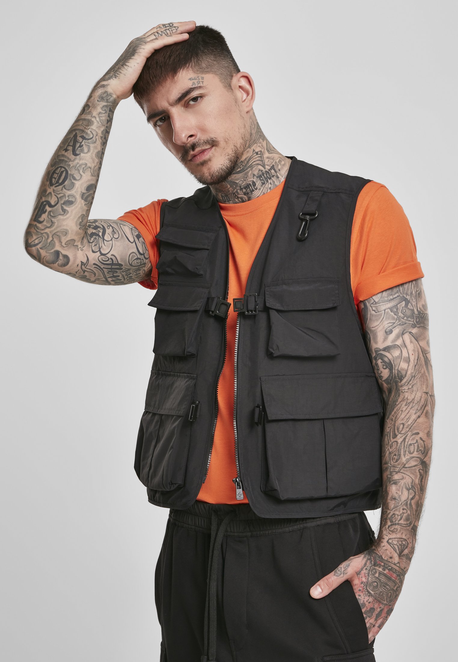 A rugged Tactical Vest featuring multiple pockets, adjustable clips, and durable fabric, perfect for outdoor and urban use.