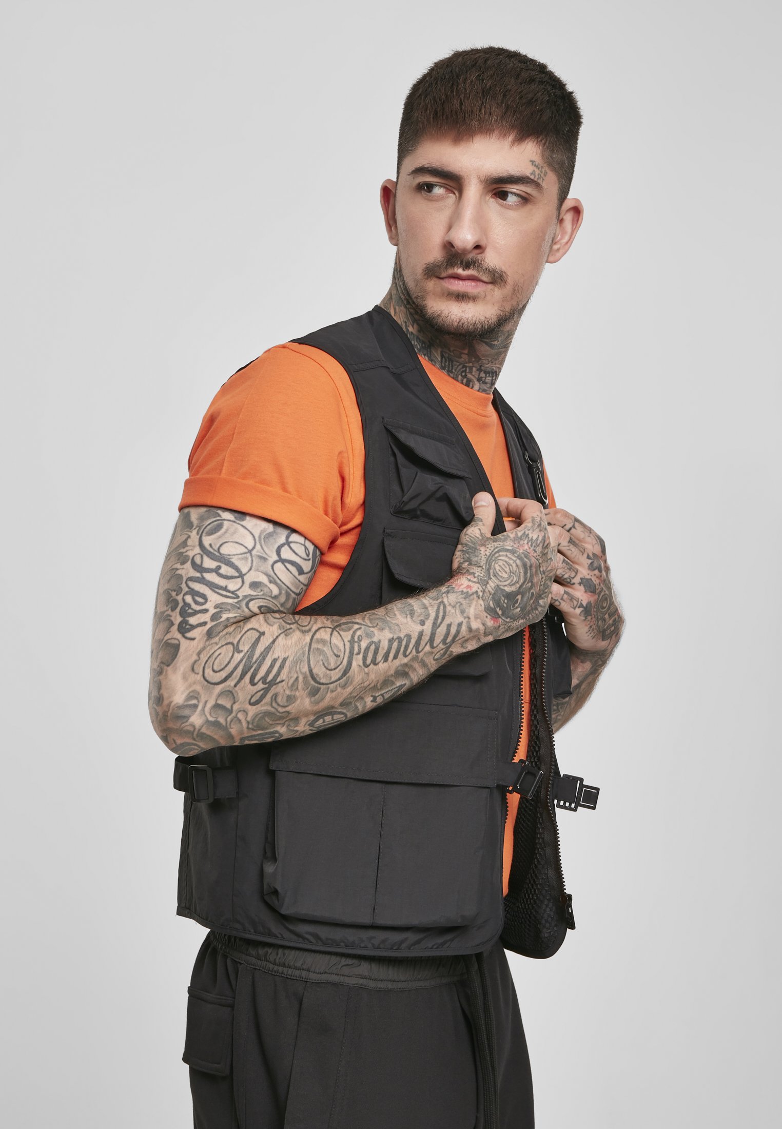 A rugged Tactical Vest featuring multiple pockets, adjustable clips, and durable fabric, perfect for outdoor and urban use.