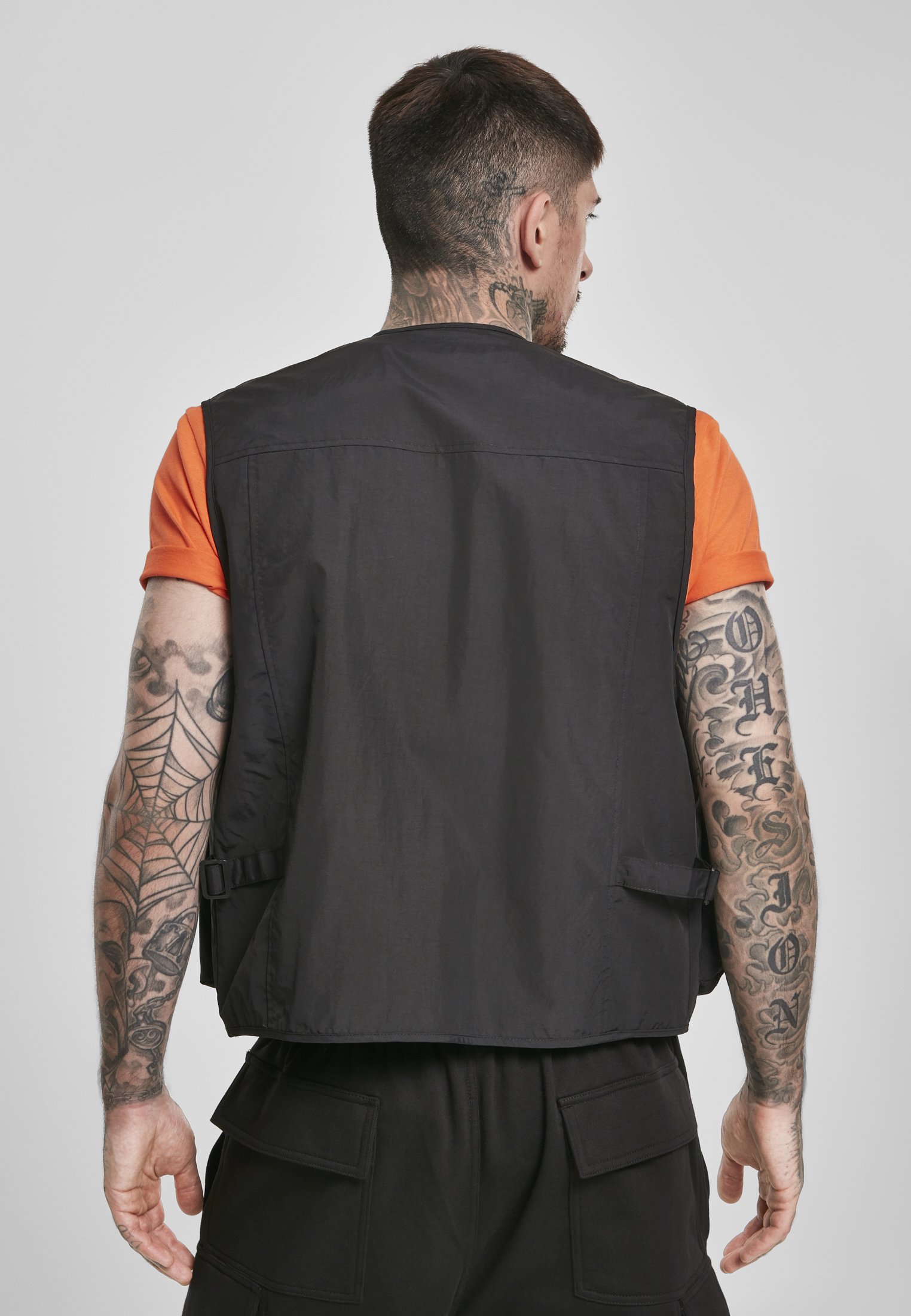 A rugged Tactical Vest featuring multiple pockets, adjustable clips, and durable fabric, perfect for outdoor and urban use.