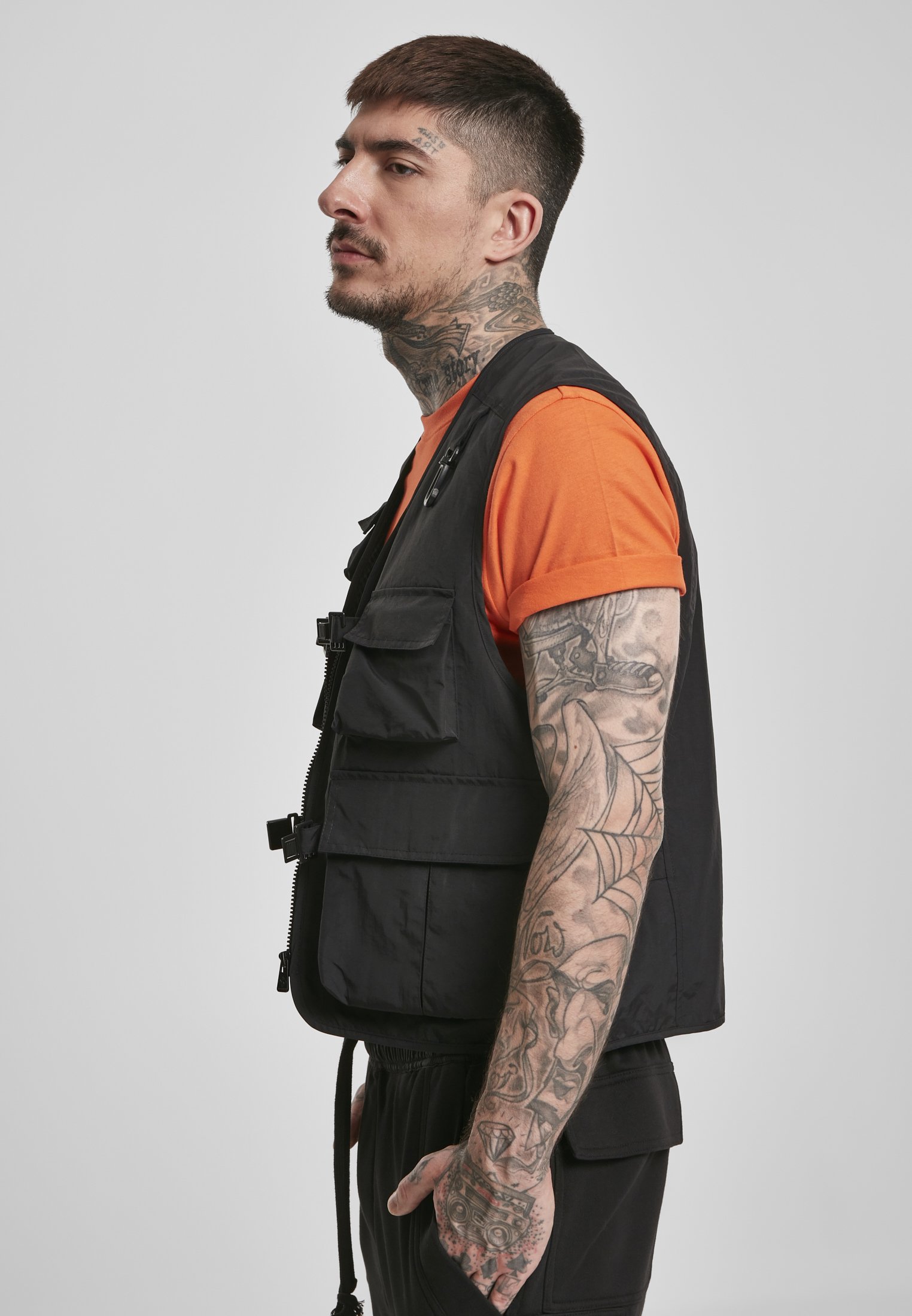 A rugged Tactical Vest featuring multiple pockets, adjustable clips, and durable fabric, perfect for outdoor and urban use.