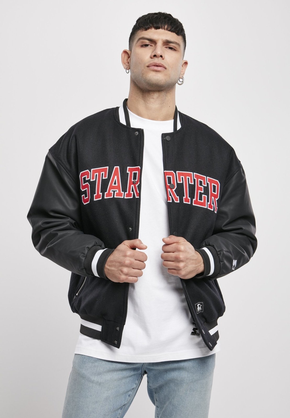 Men's Team Authentic Oldschool College Jacket featuring contrasting sleeves, embroidered branding, and sporty striped cuffs.