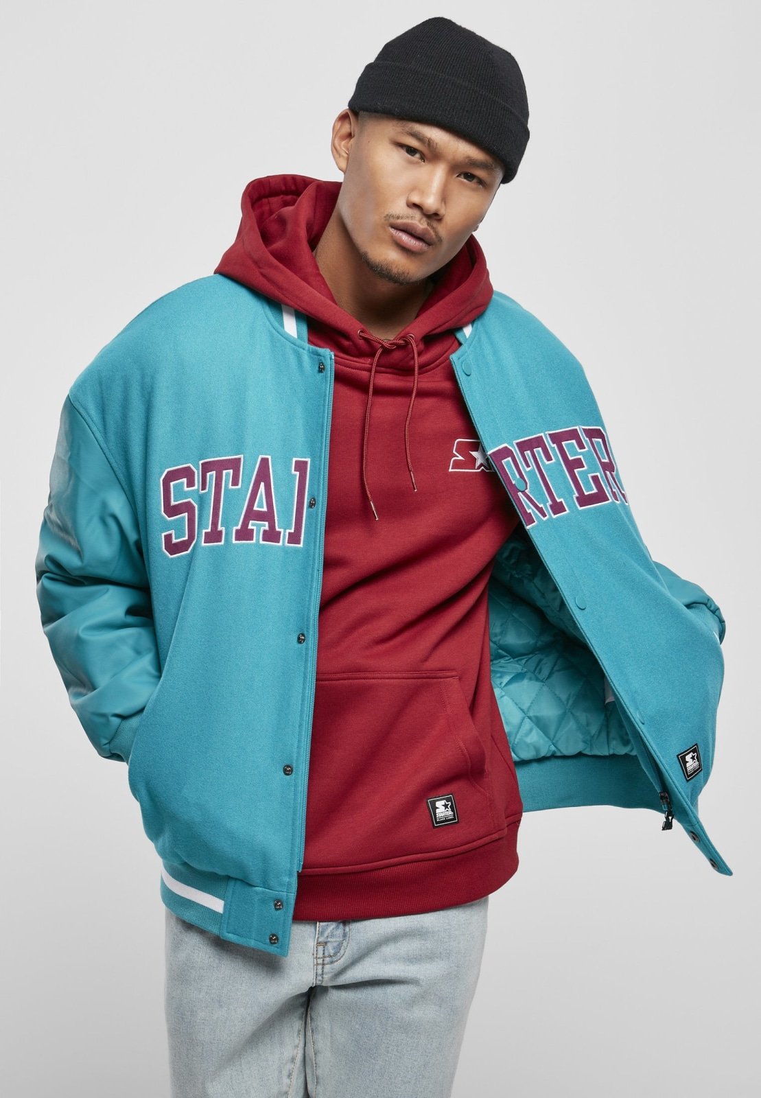 Men's Team Authentic Oldschool College Jacket featuring contrasting sleeves, embroidered branding, and sporty striped cuffs.