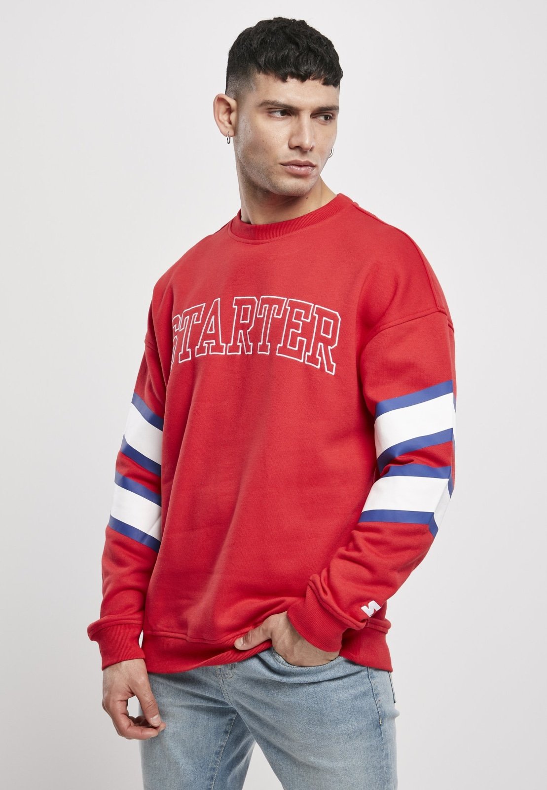 Team Front Crew Sweatshirt featuring embroidered lettering and stitched elbow tapes, made from soft brushed fleece.