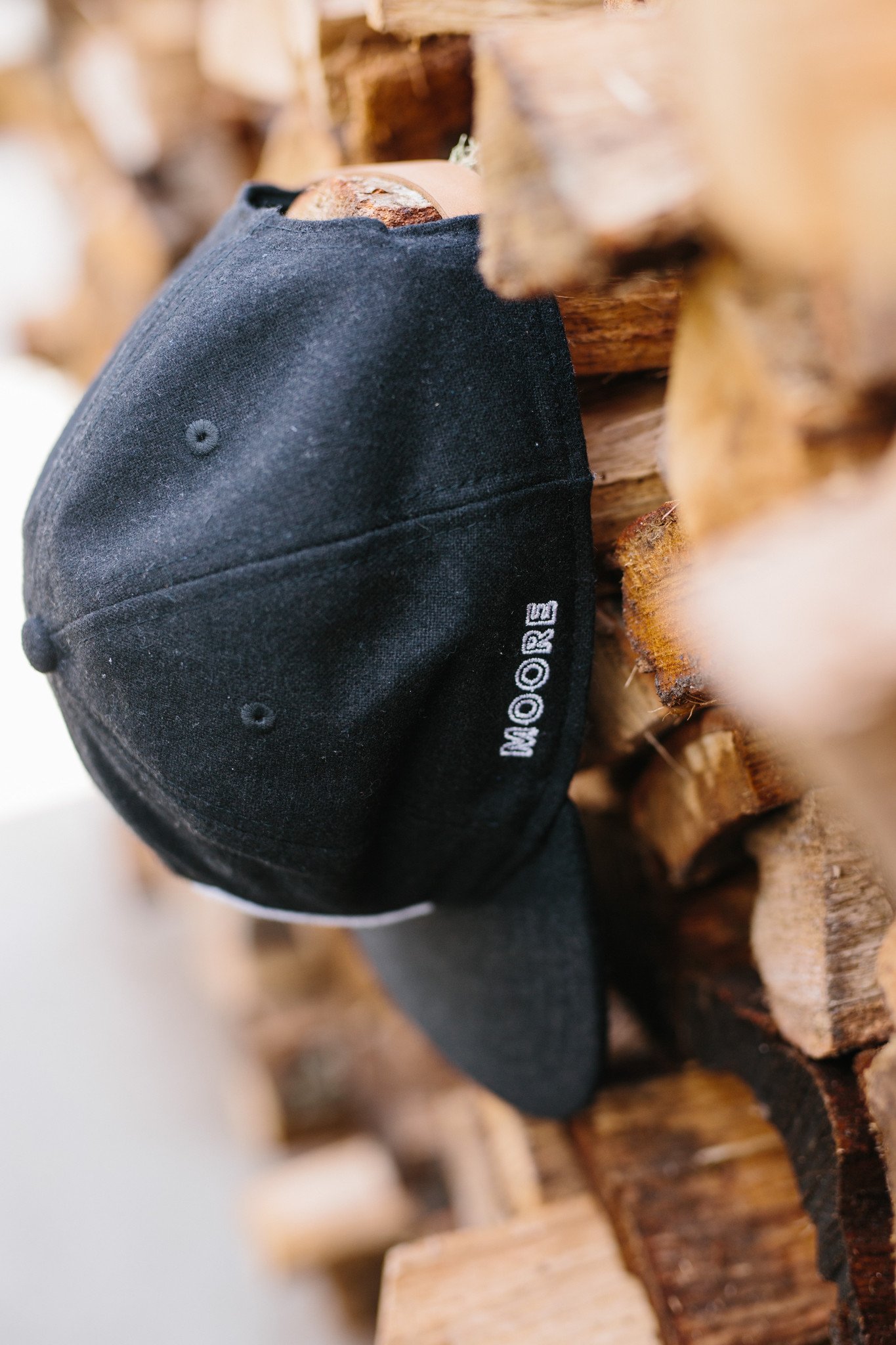 Tent Hat in black flannel featuring lightweight material, adjustable leather strap, and vintage baseball cap design.