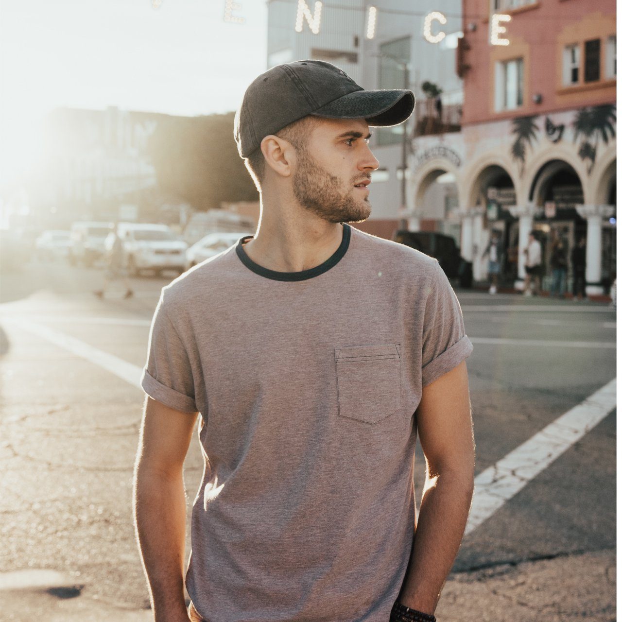 The Coachella Bundle featuring a striped ringer tee and a snow washed dad hat, perfect for summer outings.