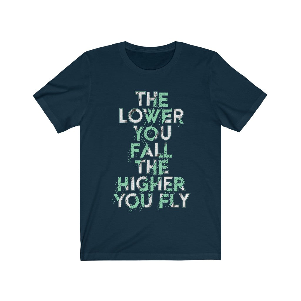 A unisex T-shirt featuring the motivational quote 'The Lower You Fall The Higher You Fly', made from soft cotton fabric.