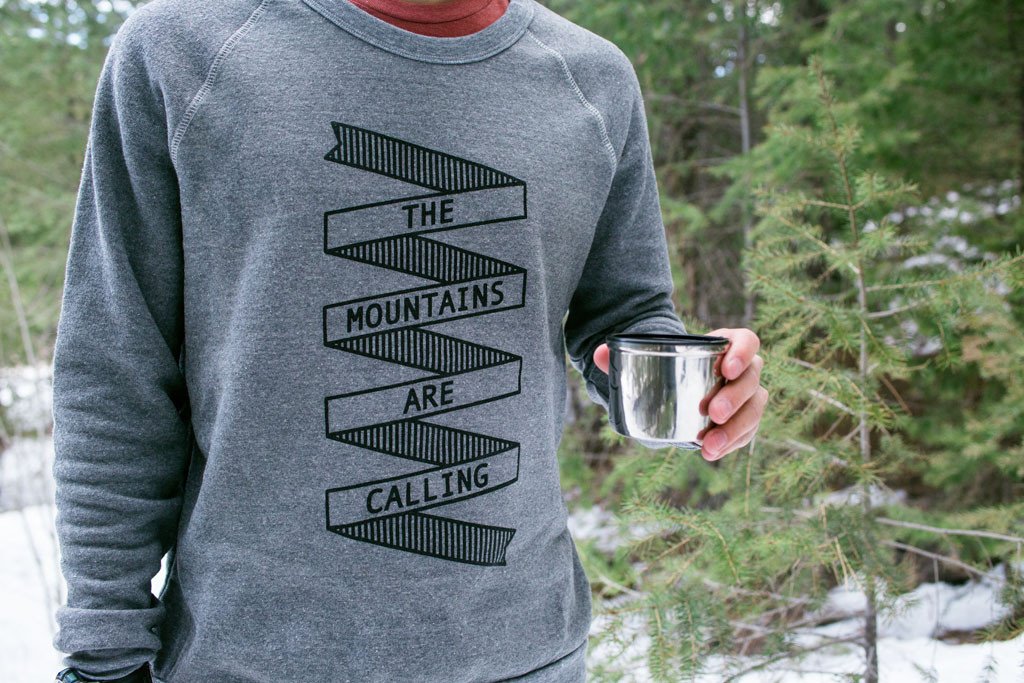 A cozy Mountains Crewneck sweatshirt featuring a clean graphic design inspired by nature, made from soft cotton and polyester blend.