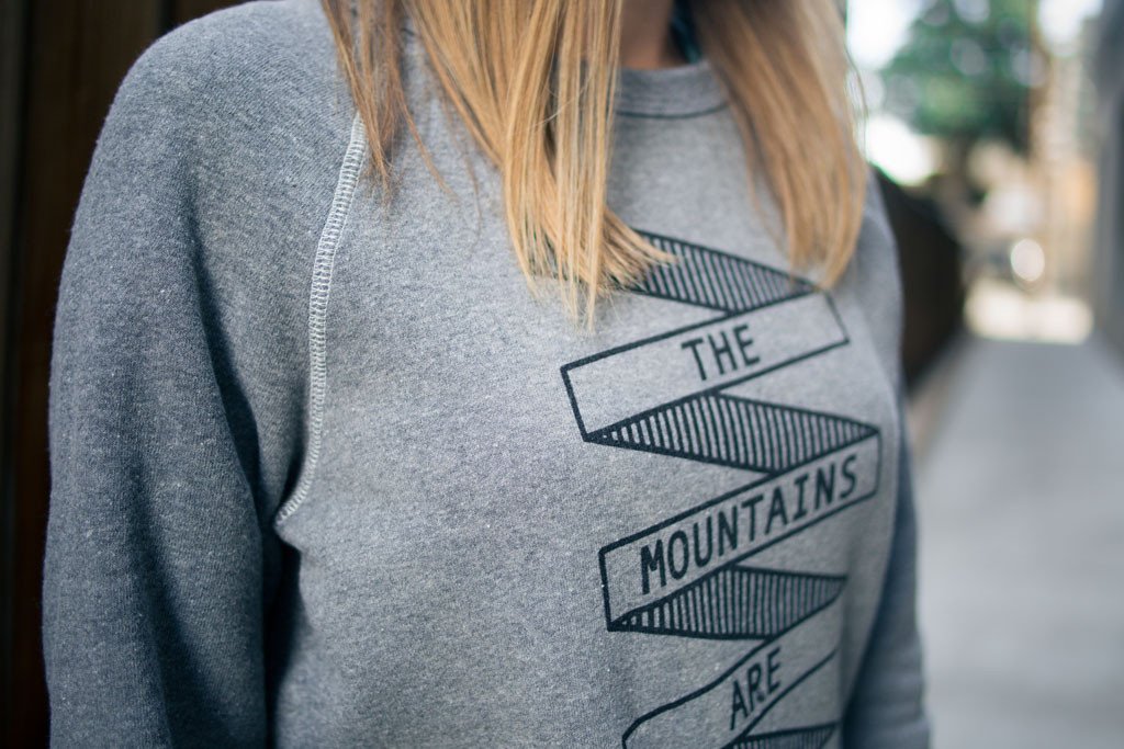 A cozy Mountains Crewneck sweatshirt featuring a clean graphic design inspired by nature, made from soft cotton and polyester blend.