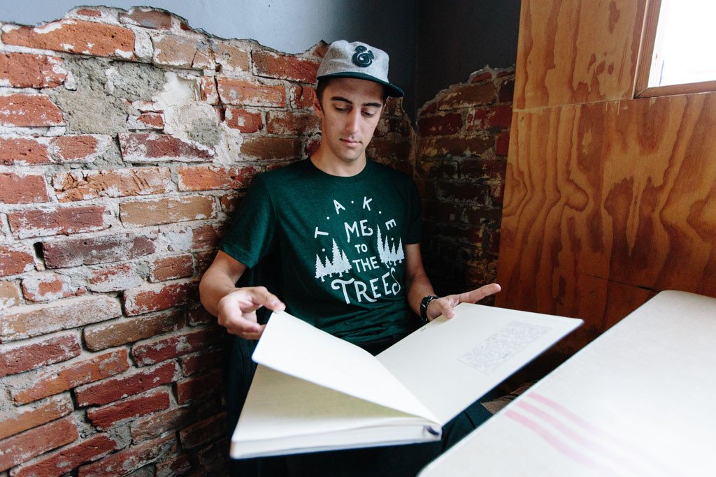 Emerald green Trees Tee featuring a nature-inspired design, hand screen printed with white water-based ink.