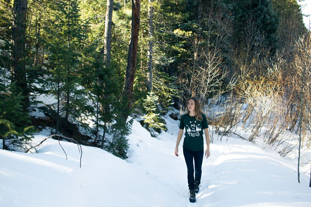 Emerald green Trees Tee featuring a nature-inspired design, hand screen printed with white water-based ink.