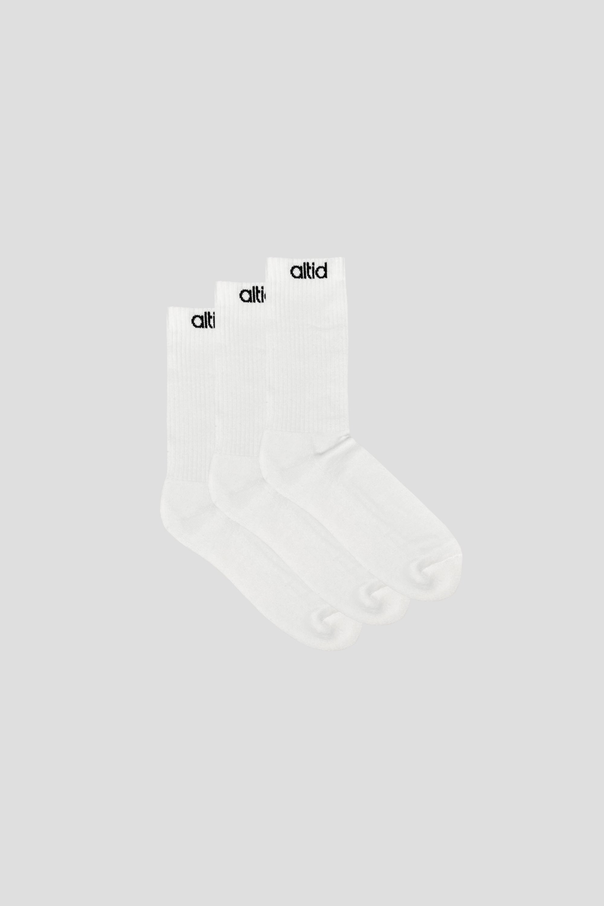 Three pairs of altid logo socks in a pack, showcasing their organic cotton blend and stylish design.