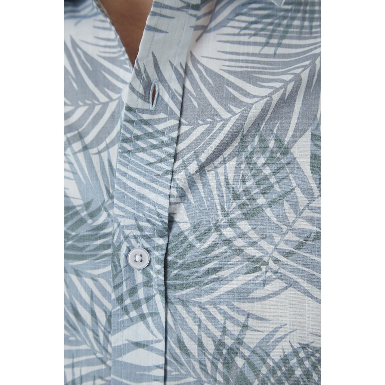 Toby Shirt featuring a vibrant palm leaves print, short sleeves, and a button-down design, made from 100% cotton.