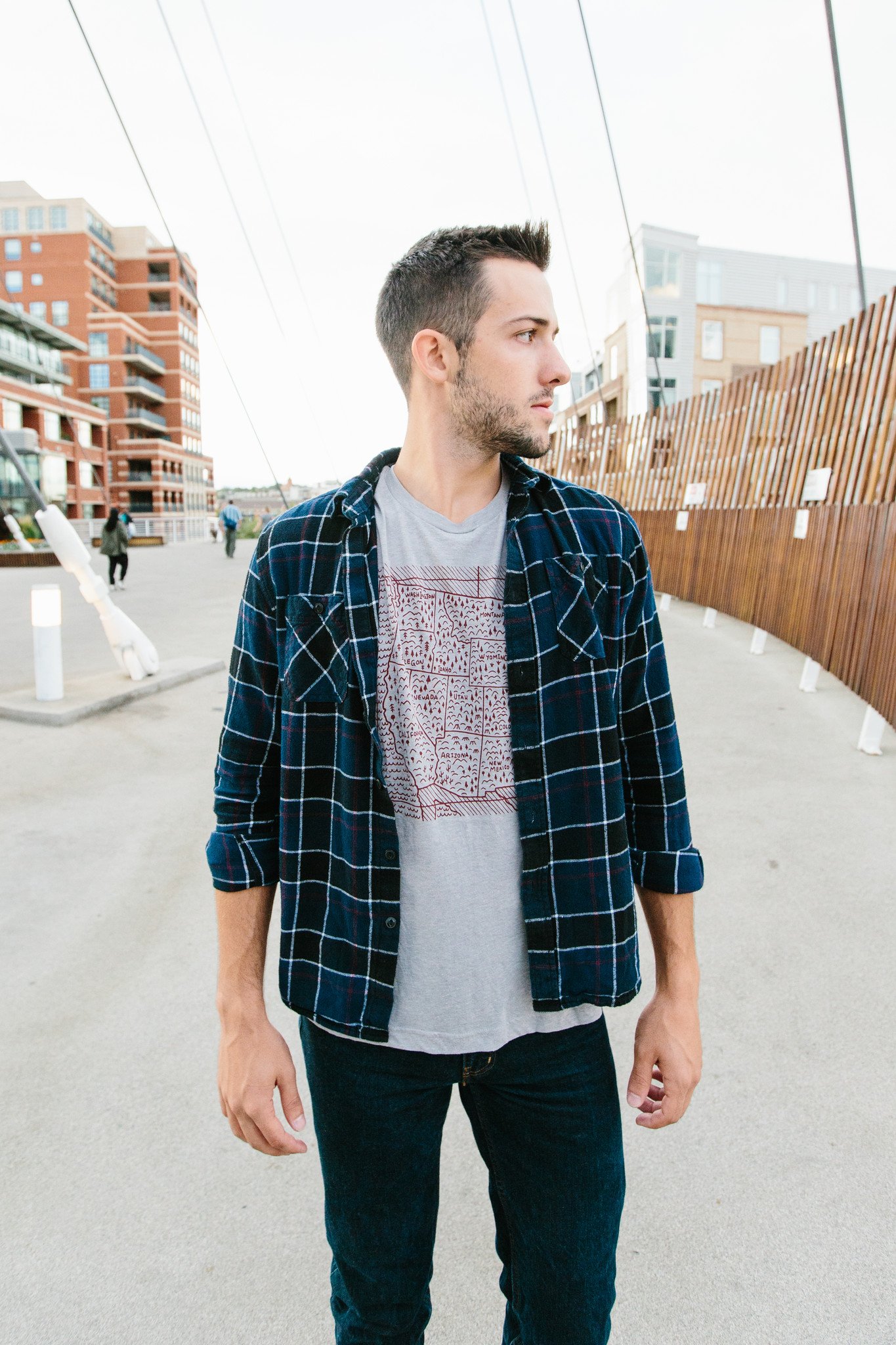 Navy Travel West Tee featuring white screen printed design, made from soft tri-blend fabric.