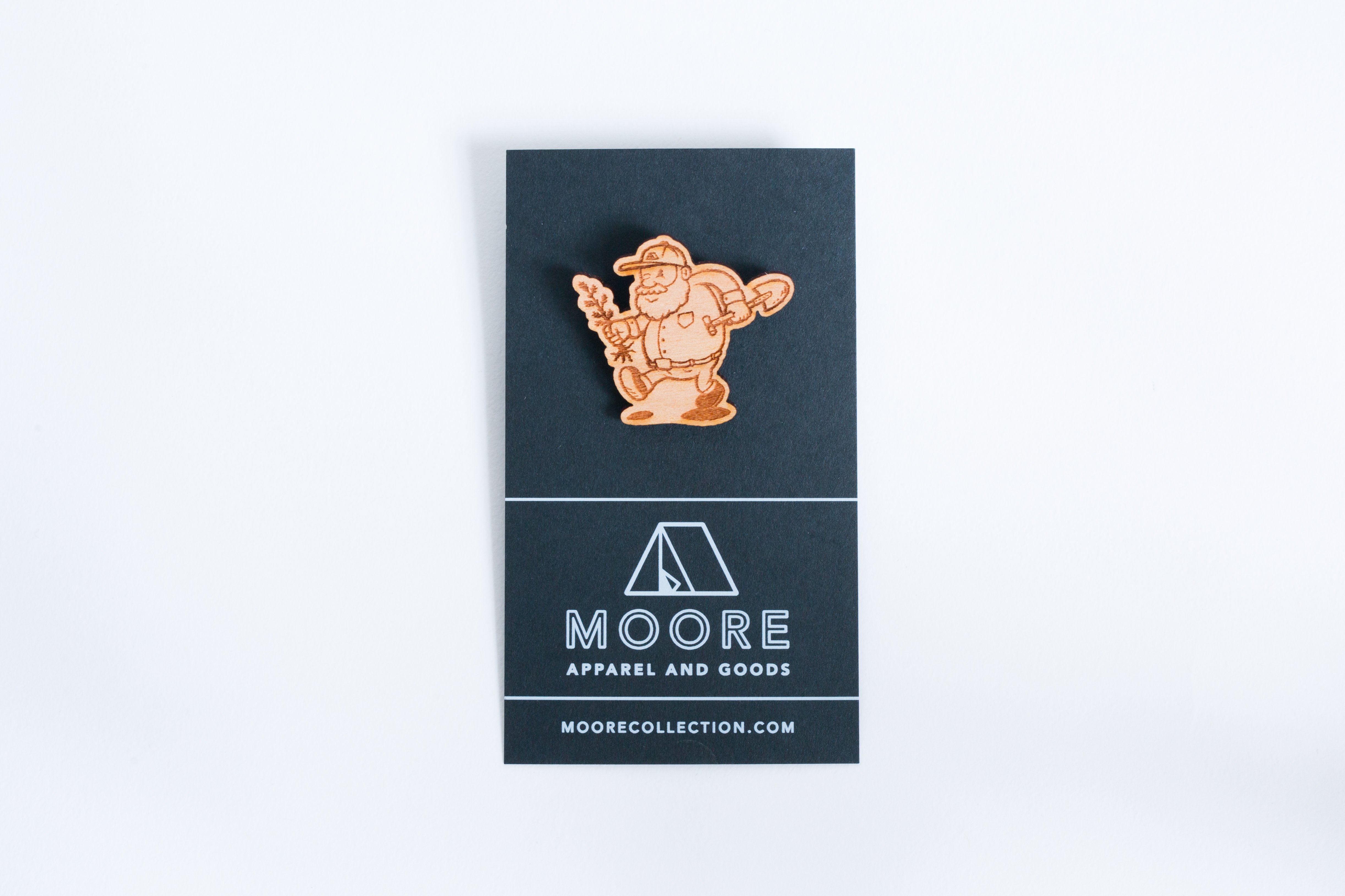 Tree Planter Wooden Pin featuring a joyful caricature of a man planting trees, crafted from high-quality wood.