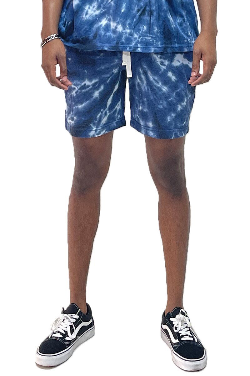 A pair of Twisted Tie Dye Shorts featuring an elastic waist, drawstring, and pockets, showcasing vibrant colors and a stylish design.