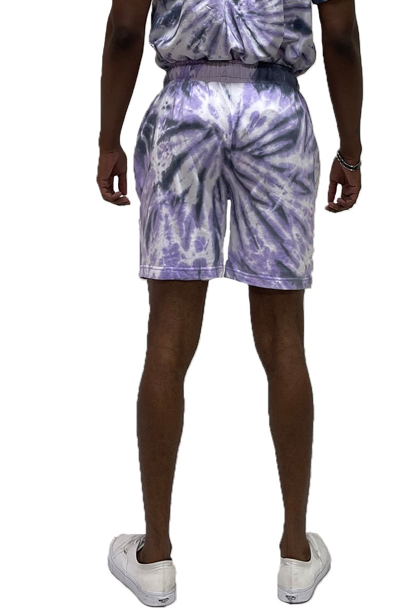 A pair of Twisted Tie Dye Shorts featuring an elastic waist and pockets, showcasing a vibrant tie-dye pattern.