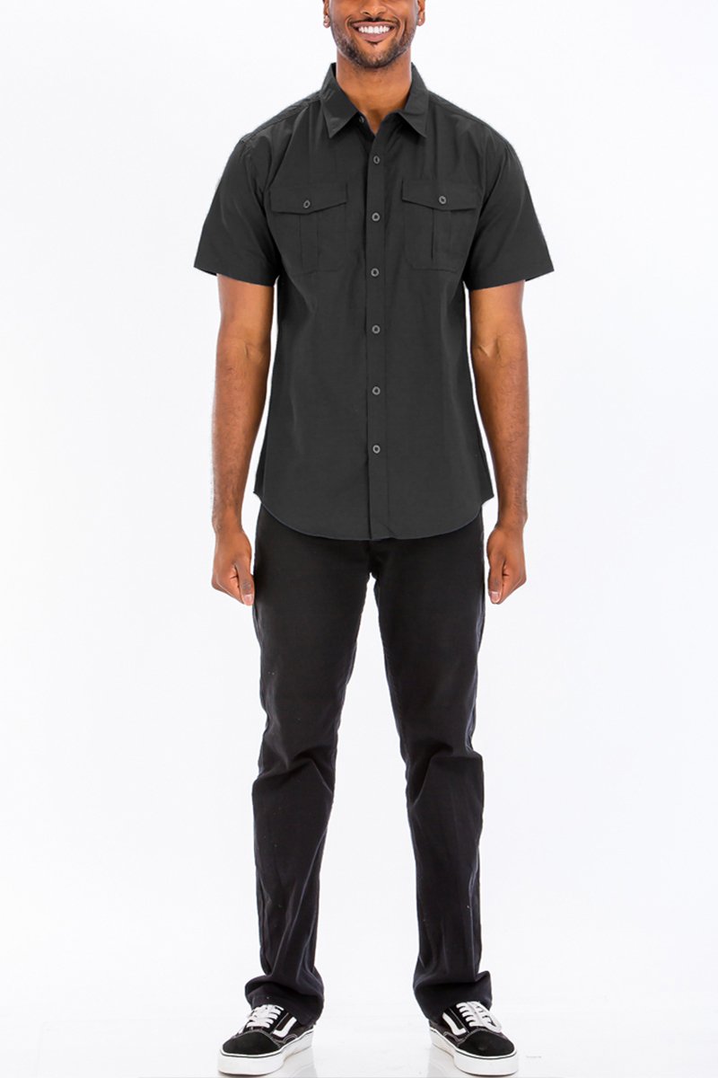 A stylish black two pocket button down shirt with short sleeves, featuring a round hem and button flap pockets.