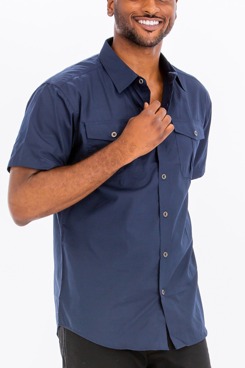 Navy Two Pocket Button Down Shirt featuring short sleeves and a round hem, made from a cotton-polyester blend.