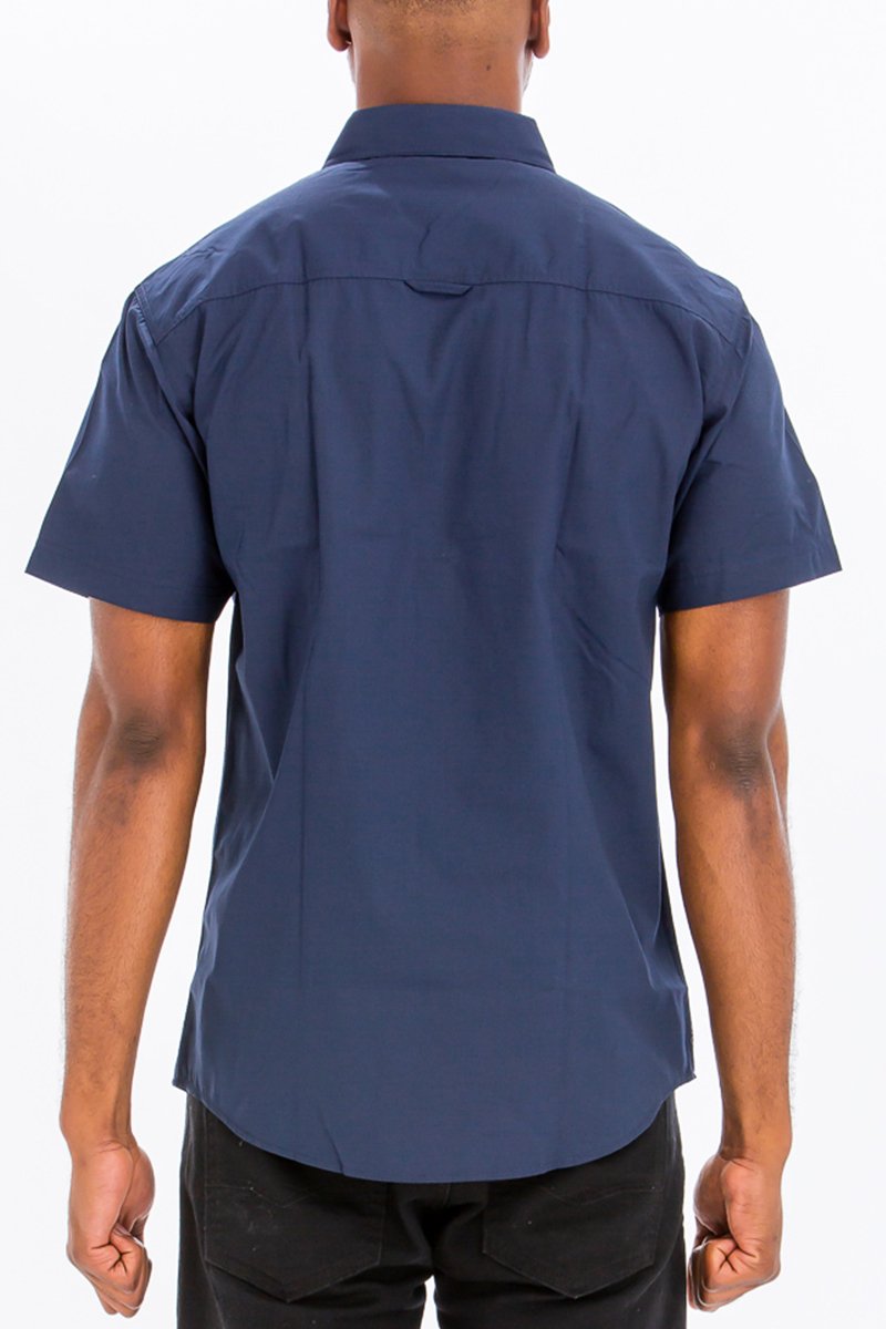 Navy Two Pocket Button Down Shirt featuring short sleeves and a round hem, made from a cotton-polyester blend.